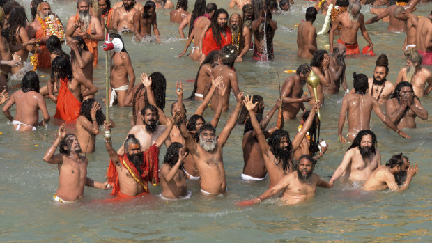 About 20,000 devout Hindus gathered by the Ganges river in the northern city of Haridwar on the last auspicious day of the festival for a bath they believe will wash away their sins.