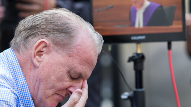 A victim of the Catholic church weeps as Judge Peter Kidd delivers his sentence in Melbourne.