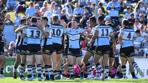 Surburban legend: The Sharks celebrate victory over the Warriors at Pointsbet Stadium.