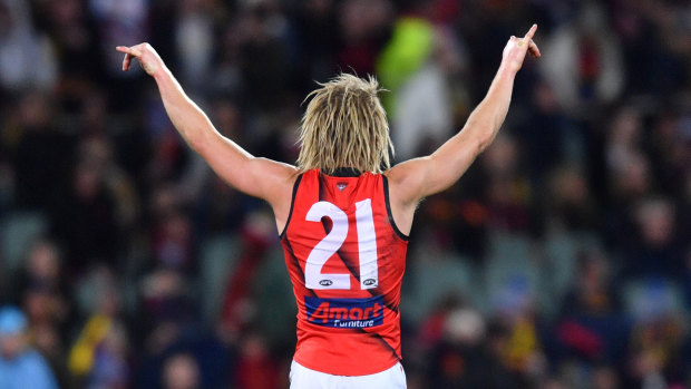 Dyson Heppell drinkls up the atmosphere at Adelaide Oval after the Bombers win on Friday night.