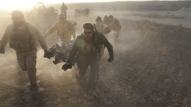 US special forces rush a wounded Afghan soldier to a helicopter of the 101st Aviation brigade in Afghanistan's southern Kandahar province in December 2010.