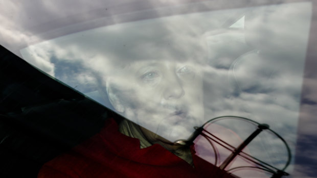 German Chancellor Angela Merkel sits in a car as she arrives for a leaders meeting of her Christion Democratic Union party at the party's headquarters in Berlin on Monday.
