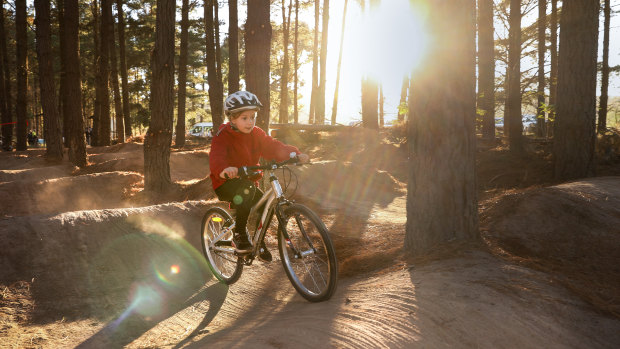 Isla Hannah, 6, rides on the new mountain bike trail which opened at Majura Pines on Wednesday.