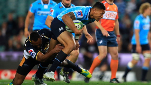 Hard yards: Israel Folau attempts to give the Waratahs some momentum.