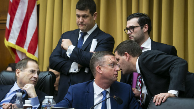 Representative Doug Collins, a Republican from Georgia and ranking member of the House Judiciary Committee, centre, speaks with an aide beside Representative Jerry Nadler, a Democrat from New York and chairman of the House Judiciary Committee, left, during the hearing.