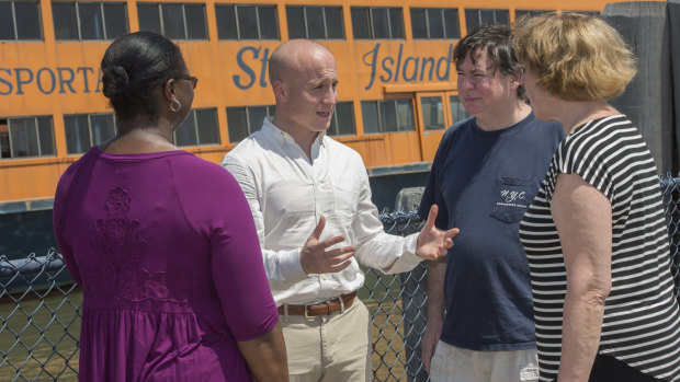 Max Rose, Democratic candidate for New York's 11th congressional district, campaigns at the Staten Island ferry terminal.