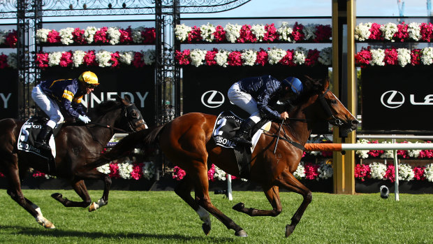 Damien Oliver takes Personal across the finish line.