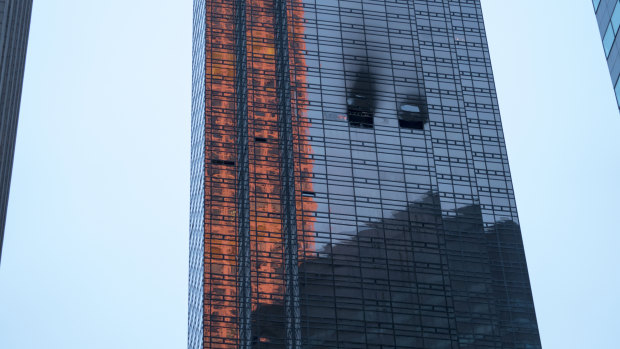 Fire damage can be seen at Trump Tower after a fire broke out on the 50th floor. 