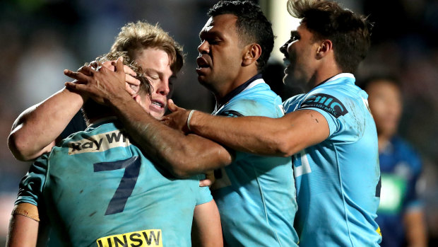 Staying alive: a try to captain Michael Hooper provided the spark to keep the Waratahs in the fight until the end on Saturday. 