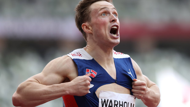 Norway’s Karsten Warholm reacts after beating his own world record mark.