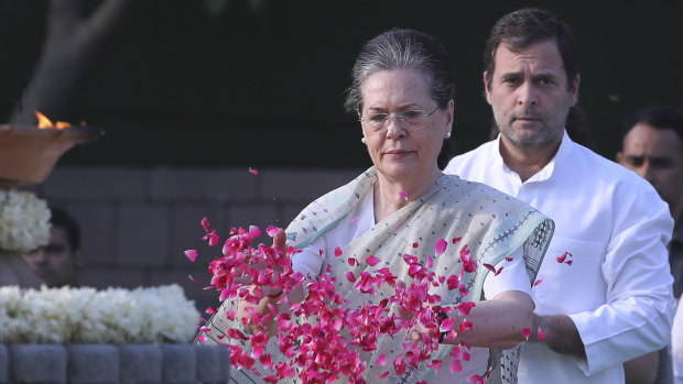 United Progressive Alliance chairperson Sonia Gandhi, centre, and her son and Congress Party president Rahul Gandhi pay homage to former Indian prime minister Rajiv Gandhi.