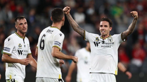 Matt Derbyshire celebrates with teammate Aleksander Jovanovic after Macarthur's inaugural A-League win on Wednesday.