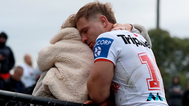 Jack De Belin reacts with his family after playing against Western Suburbs at Lidcombe Oval on his return to the game.