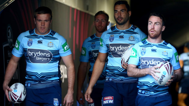 In the background: Matt Prior with Jake Trbojevic, Ryan James and James Maloney as the Blues walk out to a media session at ANZ Stadium.