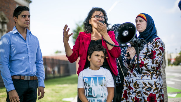 Rashida Tlaib with her family at a protest outside an Immigration and Customs Enforcement detention facility in Detroit earlier this month.
