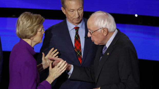 Democratic presidential candidates Elizabeth Warren and Bernie Sanders share a tense moment after the debate.