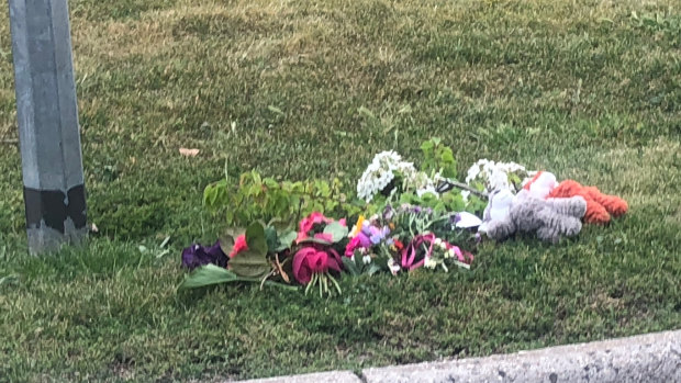 Flowers and toys left on Kiwi Retreat on Sunday.