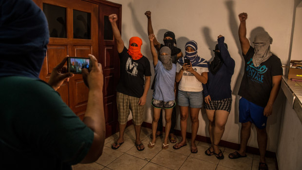 Anti-government dissidents, many wanted by Nicaraguan authorities, record a video message to post to social media at the safe house.