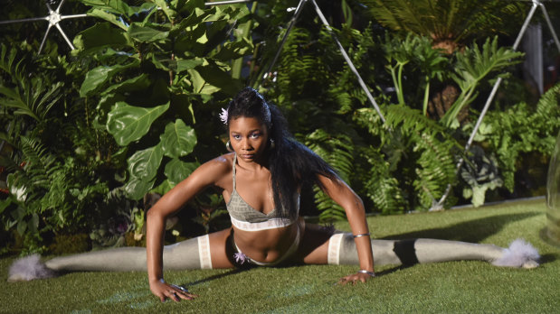 A model does the splits at the Savage x Fenty show at NYFW.