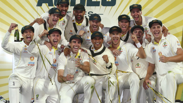Pat Cummins and the victorious Australia team celebrate their Ashes triumph in Hobart.