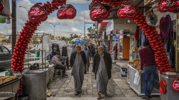 Valentine's Day decorations in a busy market area of eastern Mosul.