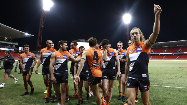 The Giants celebrate a much-needed win over Collingwood.