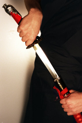 A woman has been charged after allegedly injuring a man with a Samurai sword in Sydney's west.