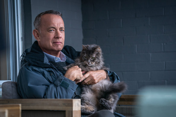 Tom Hanks, aka Tom Hanks the novelist, with feline friend in A Man Called Otto.