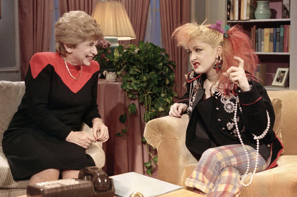 Dr Ruth talks with rock singer Cyndi Lauper in New York in 1985.