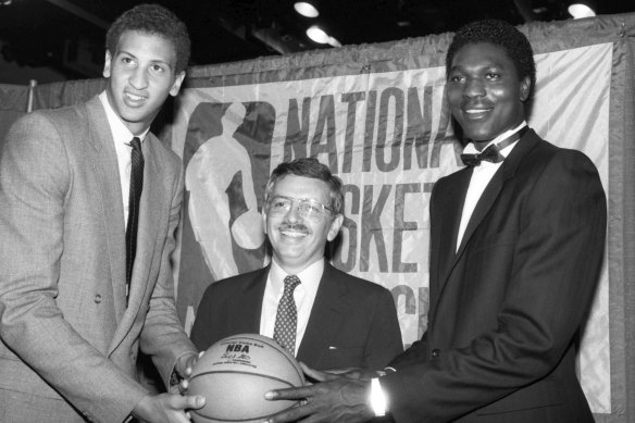 Stern led the NBA for 30 years. Here he is flanked by Akeem Olajuwon (left) and Sam Bowie (right) at the 1984 NBA draft.