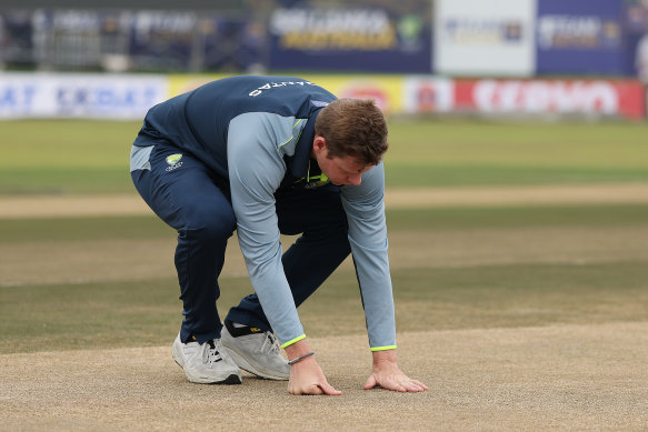 Steve Smith examines the pitch in Galle.