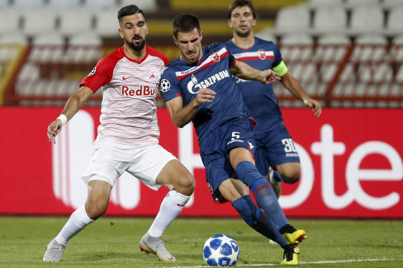 Milos Degenek, centre, has won the Serbian title with Red Star Belgrade.