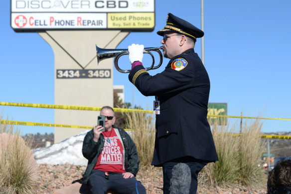 Michael Robert Travis performs taps while his husband, Michael Travis, films on his phone near the gay nightclub that was the scene of a mass shooting.