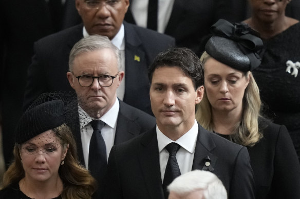 Prime Minister Anthony Albanese with his partner Jodie Haydon are pictured behind Canadian Prime Minister Justin Trudeau at the state funeral for Queen Elizabeth.