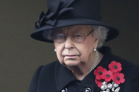 Queen Elizabeth looks on from the balcony of the Foreign Office during the Remembrance Sunday service at the Cenotaph in London on November 8, 2020. 