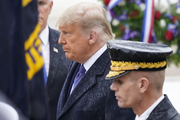 President Donald Trump at a National Veterans' Day ceremony on Wednesday, one of a few times he's been seen in public since the election.
