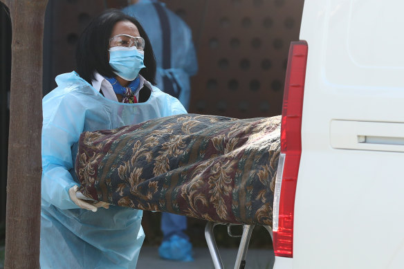 A body is removed from Epping Gardens aged care home on Wednesday.