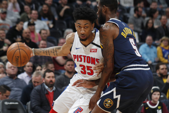 Detroit Pistons forward Christian Wood (left).