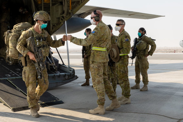 Soldiers from the 1st Battalion, Royal Australian Regiment, are welcomed to Australia’s main operating base in the Middle East after a flight from Afghanistan. The surveys were conducted during a period in which Australian troops were withdrawn from Afghanistan.