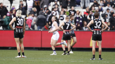 Close loss: Dejected Pie splayers stand around after the final siren.