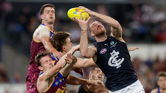 Harry McKay of the Blues marks the ball.