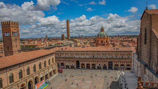 View over Bologna’s Piazza Maggiore, with Garisenda and Asinelli towers at rear.