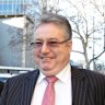 Former Purana taskforce chief detective Jim O’Brien (centre) outside court in 2012.