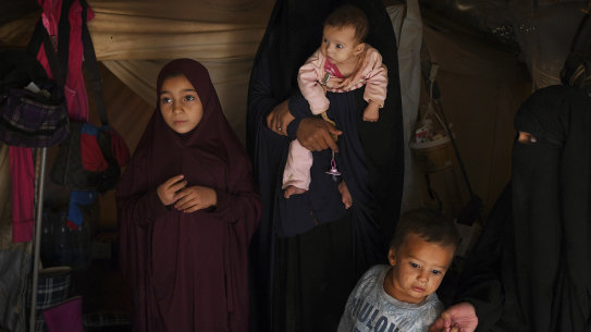 Australian’s Maysa Assaad aged 9 years old (left), Bassama Assaad (2nd from left) holding Shayma Assaad’s daughter Mariam (3rd from left), Shayma Assaad’s son Dawood (2nd from right) and Shayma Assaad (right) in al Hawl camp in North East Syria.