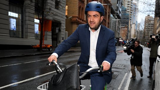On ya bike: Former Federal Labor senator Sam Dastyari leaves the Independent Commission Against Corruption hearing in Sydney.