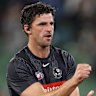 Scott Pendlebury warms up.