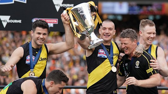 Trent Cotchin, Dustin Martin, Damien Hardwick and Jack Riewoldt celebrate with the cup.