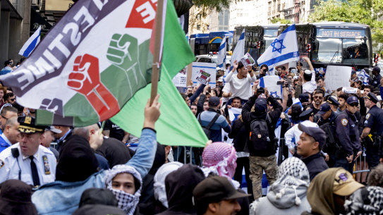 Supporters of Israel and Palestine gather at the Israeli consulate in New York on Monday.