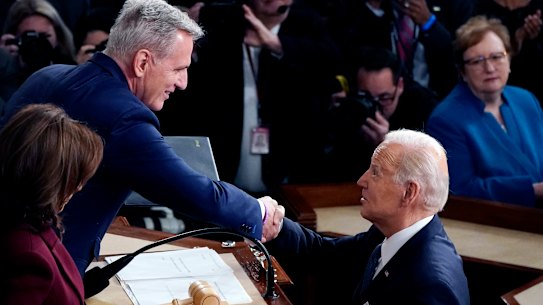President Joe Biden arrives and shakes hands with House Speaker Kevin McCarthy during his State of the Union speech in February. Today, the two are at loggerheads over the debt ceiling.