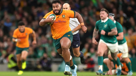 DUBLIN, IRELAND - NOVEMBER 30: Taniela Tupou of Australia runs with the ball during the Autumn Nations Series 2024 match between Ireland and Australia at Aviva Stadium on November 30, 2024 in Dublin, Ireland. (Photo by David Rogers/Getty Images)